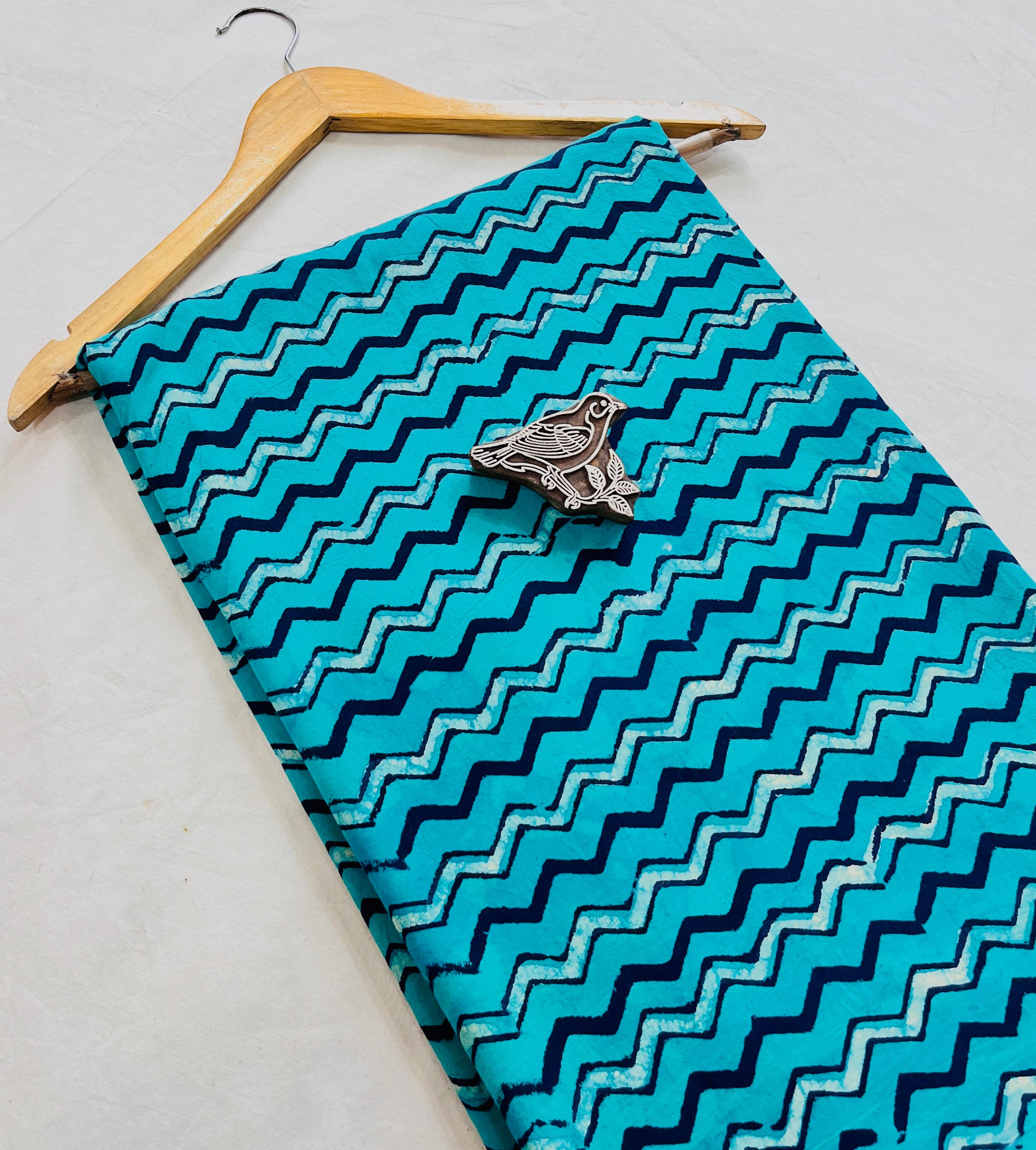 Turquoise blue zigzag geometrical Dabu handblock printed pure cotton fabric for wholesale buyers